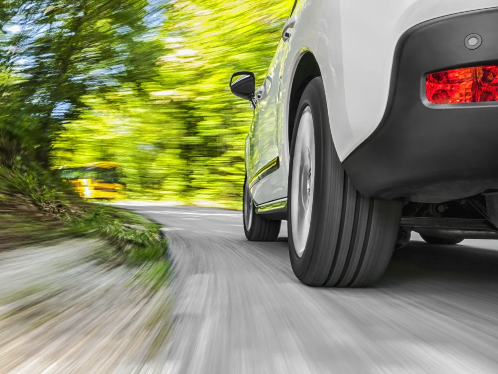 A car making a sharp turn at high speed, representing the driver behavior analysis feature on the Galagps platform.