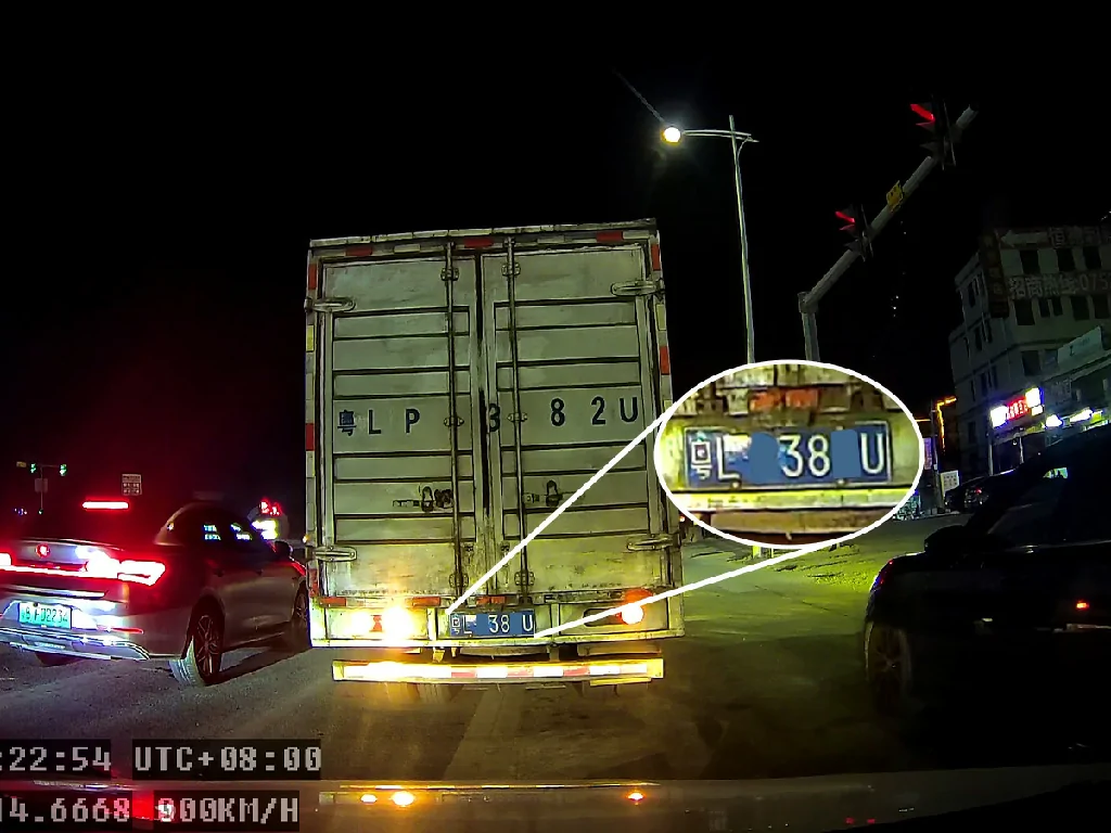 A clear 1080p night vision image from the GD17 dashcam, successfully capturing a truck's license plate in detail.