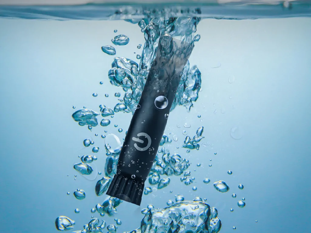 The GAT25S GPS tracker submerged in bubbling water, demonstrating its industry-leading IP68 waterproof protection.